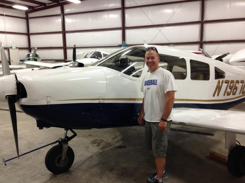 man standing in front of plane