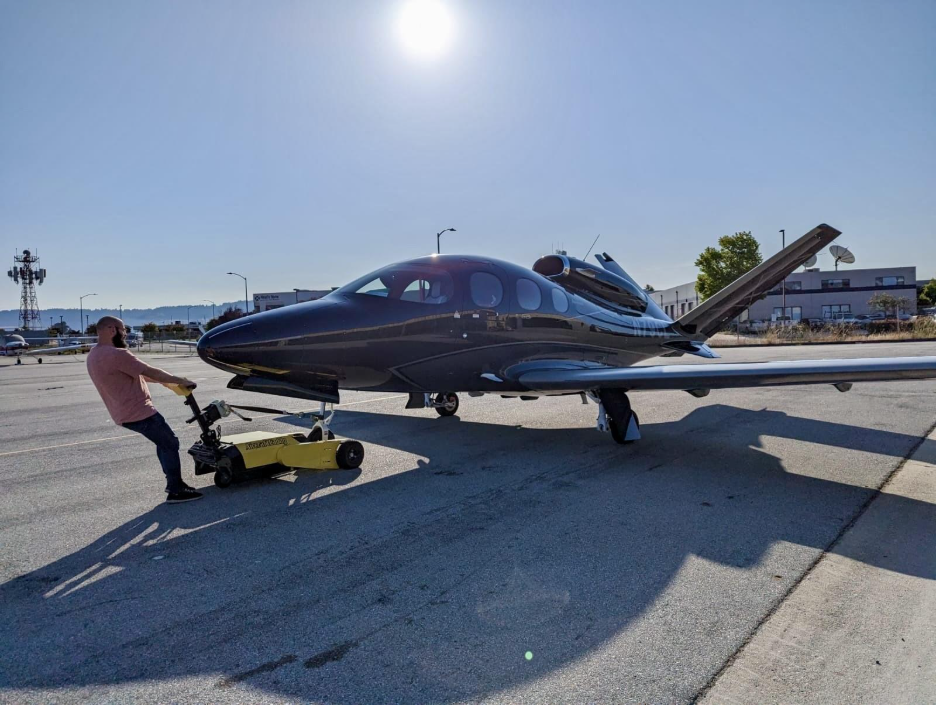man towing a vision black vision jet